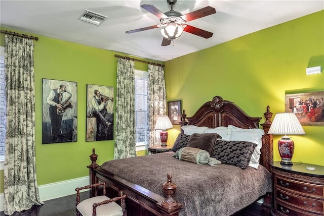 bedroom with visible vents, ceiling fan, and baseboards