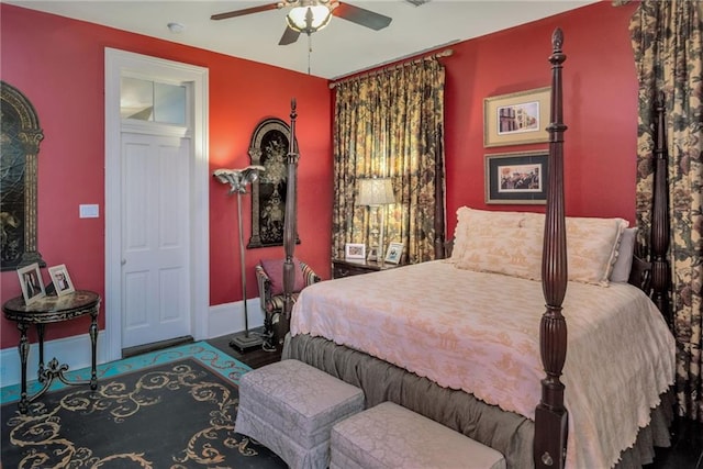 bedroom with ceiling fan and baseboards