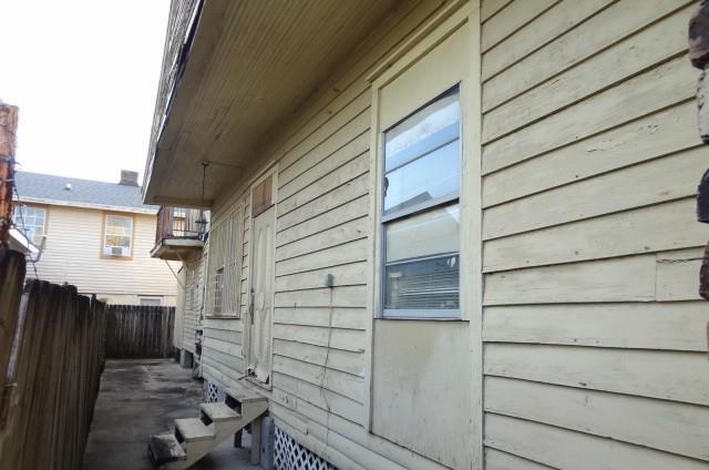 view of property exterior featuring fence