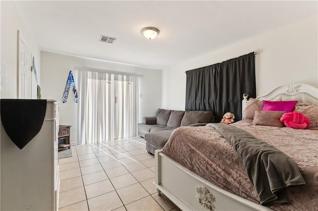 bedroom featuring light tile patterned floors and visible vents