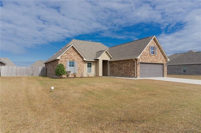 view of front of house featuring a garage, brick siding, fence, driveway, and a front lawn