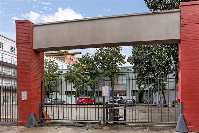 view of gate featuring fence