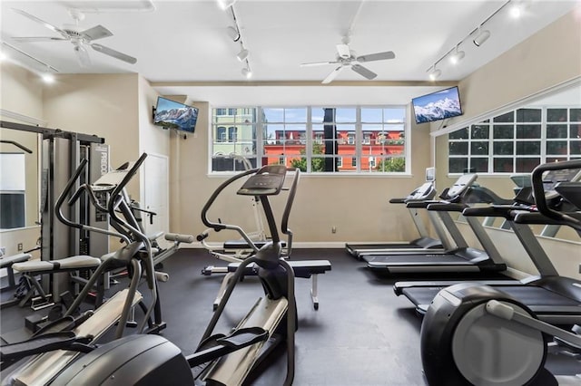 workout area with track lighting, ceiling fan, and baseboards