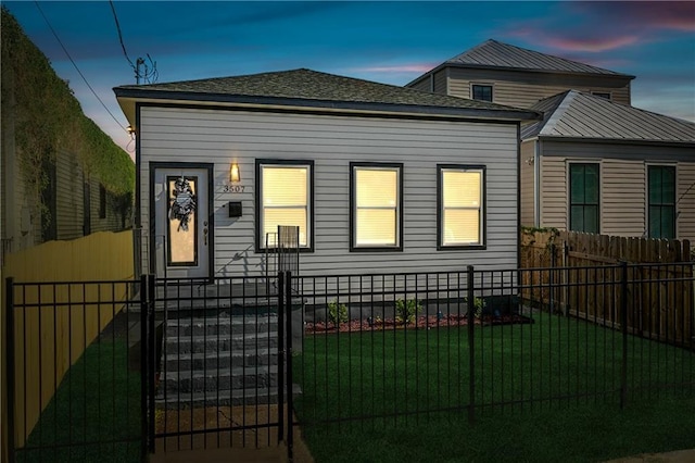 3507 Danneel St, New Orleans, LA 70115 - view of front of property featuring roof with shingles and a gate