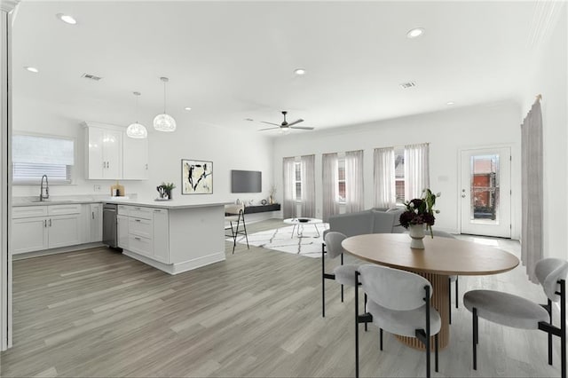 3507 Danneel St, New Orleans, LA 70115 - dining space featuring healthy amount of natural light, ceiling fan, light wood-style flooring, and recessed lighting