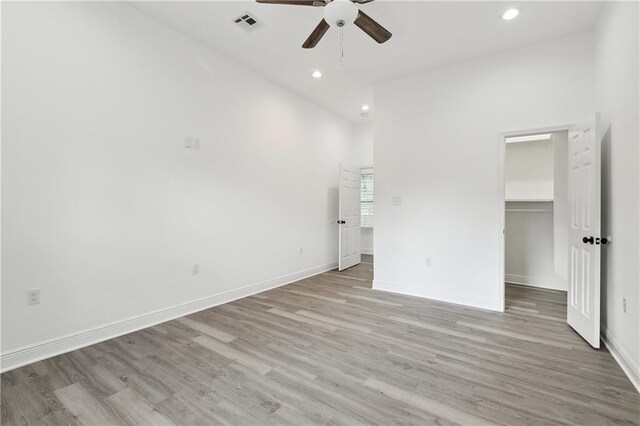 3507 Danneel St, New Orleans, LA 70115 - unfurnished bedroom featuring light wood-style floors, recessed lighting, a walk in closet, baseboards, and ceiling fan
