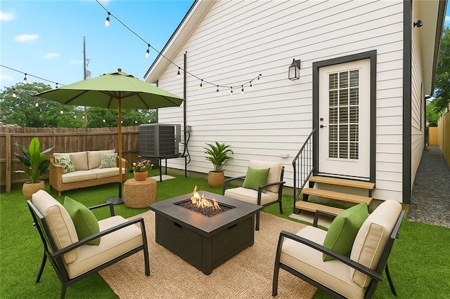 3507 Danneel St, New Orleans, LA 70115 - fenced backyard featuring entry steps, an outdoor living space with a fire pit, cooling unit, and a patio