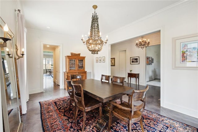 dining area with dark tile patterned floors, baseboards, a chandelier, and ornamental molding