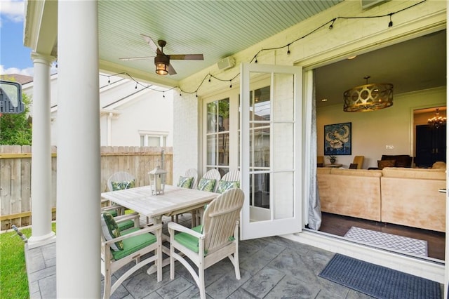 view of patio / terrace featuring outdoor dining space, fence, and ceiling fan