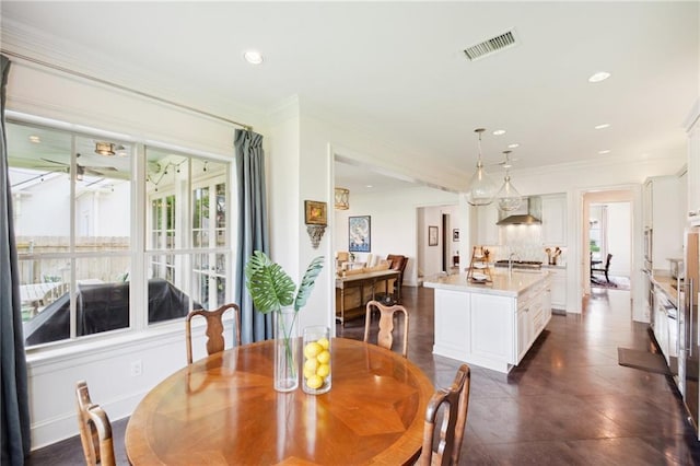 dining space featuring crown molding, recessed lighting, and visible vents