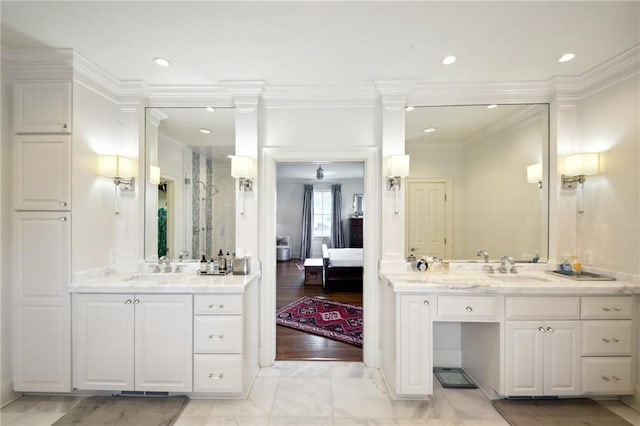 bathroom featuring a sink, ensuite bathroom, recessed lighting, and crown molding