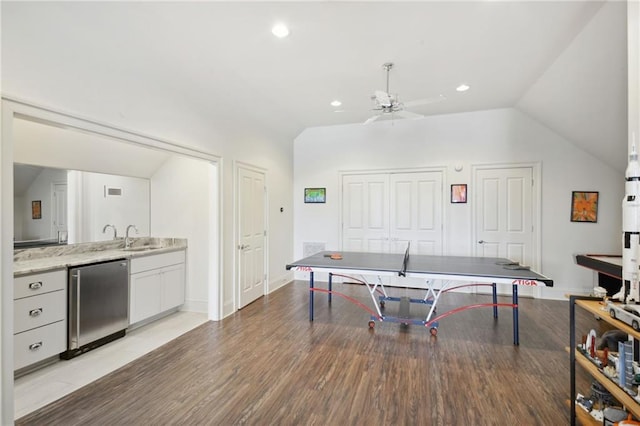 rec room with recessed lighting, light wood-style floors, ceiling fan, and vaulted ceiling