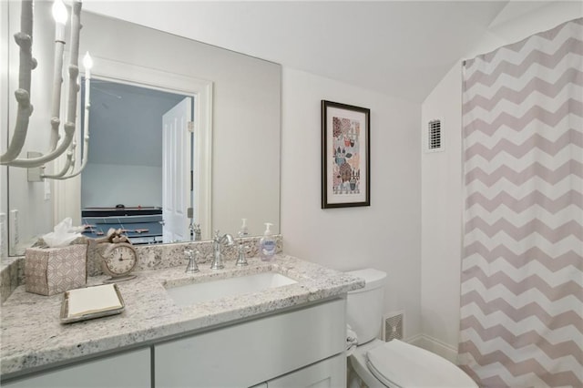 bathroom with visible vents, curtained shower, toilet, and vanity