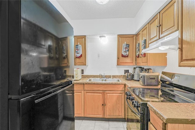 kitchen with stainless steel electric range oven, freestanding refrigerator, a sink, a textured ceiling, and under cabinet range hood