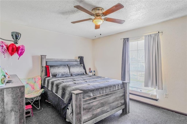 bedroom with carpet, ceiling fan, and a textured ceiling