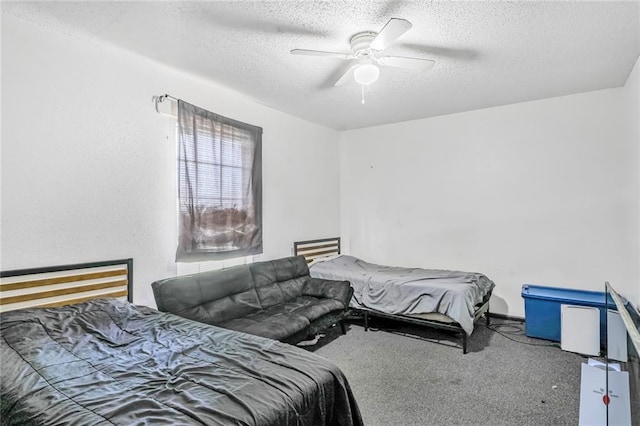 carpeted bedroom with ceiling fan and a textured ceiling