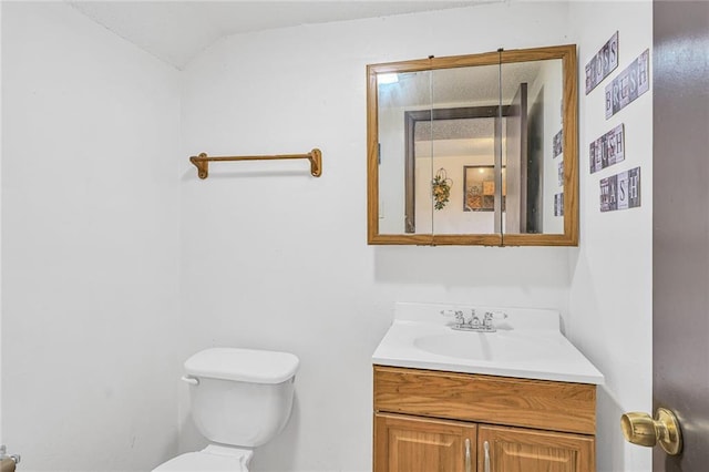 half bath with vanity and toilet