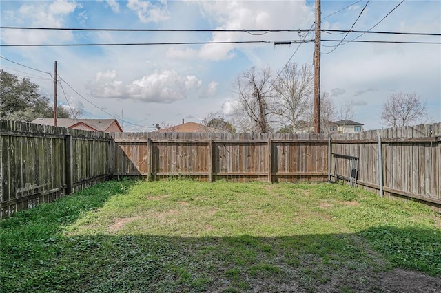 view of yard featuring a fenced backyard