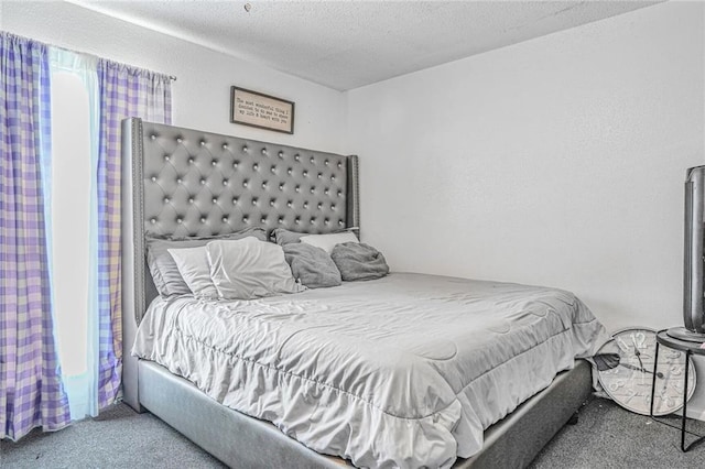 carpeted bedroom with a textured ceiling