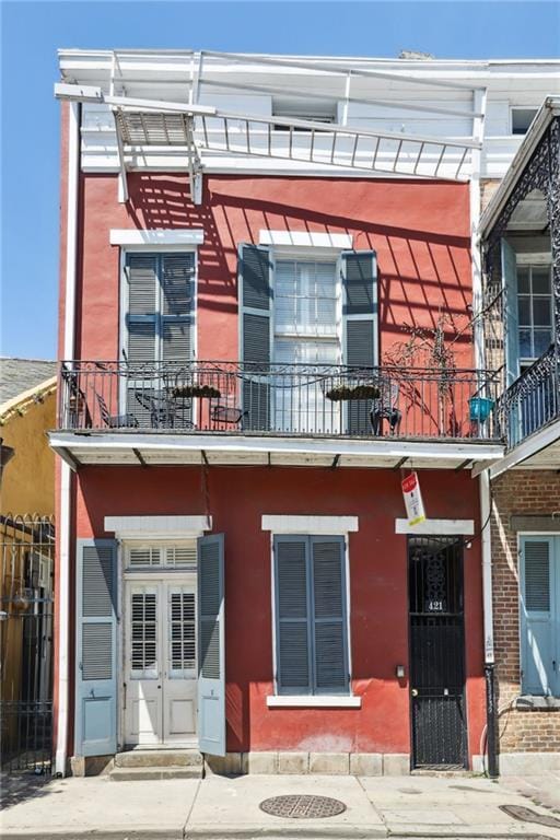 421 Burgundy St Unit 1, New Orleans, LA 70112 - view of front of home with a balcony