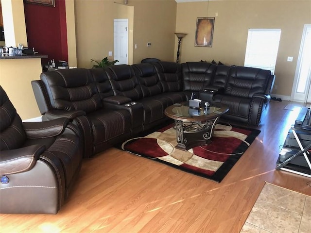 living room featuring baseboards and wood finished floors