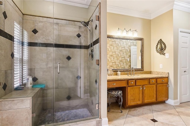 bathroom featuring baseboards, ornamental molding, a stall shower, tile patterned floors, and vanity