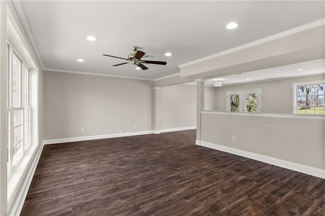 empty room with baseboards, ornamental molding, dark wood finished floors, and recessed lighting