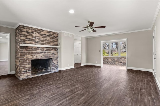 unfurnished living room with ceiling fan, a fireplace, baseboards, ornamental molding, and dark wood finished floors