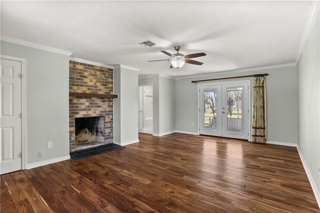 unfurnished living room featuring visible vents, ornamental molding, wood finished floors, french doors, and a brick fireplace