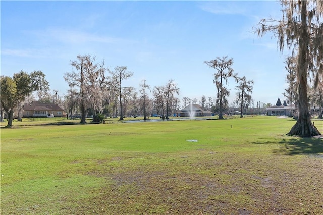 view of property's community featuring a lawn