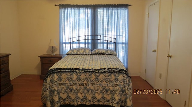 bedroom featuring wood finished floors