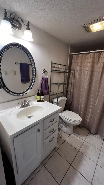 227 Plimsol Ct Unit 227, Slidell, LA 70460 - full bath with vanity, a textured ceiling, tile patterned floors, and a shower with shower curtain
