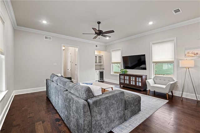 living area featuring ornamental molding, visible vents, dark wood finished floors, and baseboards