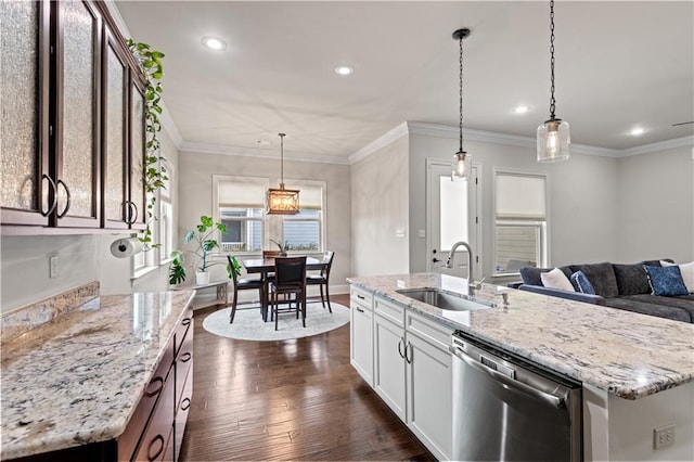 kitchen with light stone counters, a sink, ornamental molding, stainless steel dishwasher, and dark wood finished floors