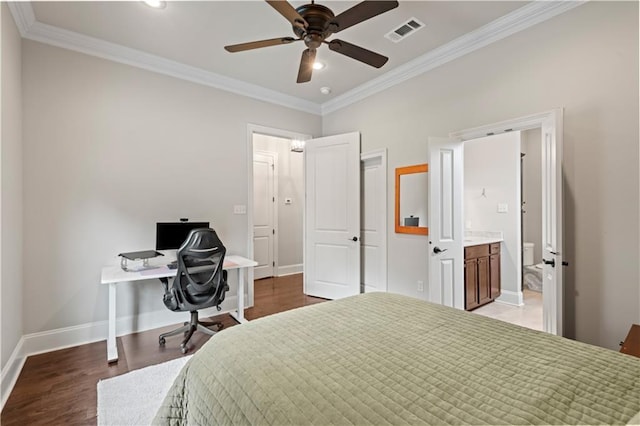 bedroom featuring light wood finished floors, baseboards, visible vents, and ornamental molding