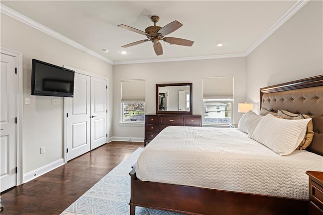 bedroom featuring dark wood finished floors, crown molding, baseboards, and recessed lighting