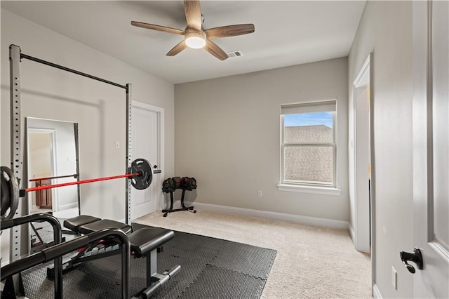 exercise area featuring ceiling fan, carpet floors, visible vents, and baseboards