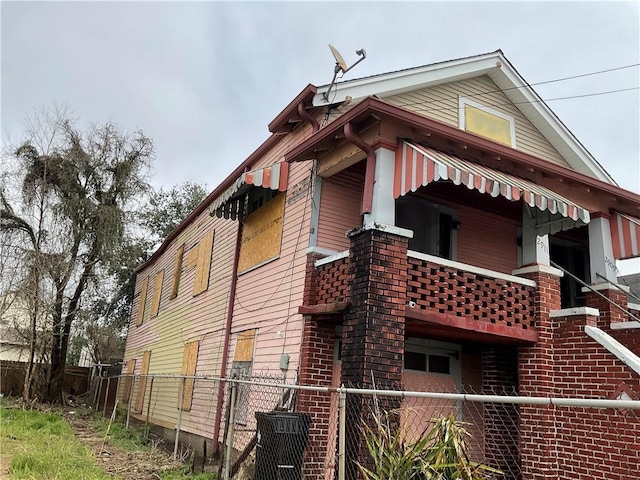 2909 1st St, New Orleans, LA 70113 - view of home's exterior featuring fence and brick siding