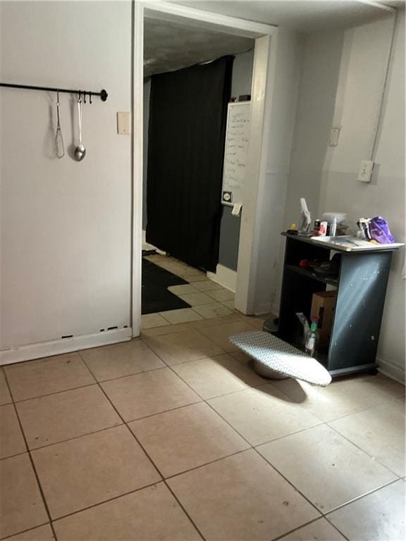 2909 1st St, New Orleans, LA 70113 - bathroom with tile patterned floors and baseboards