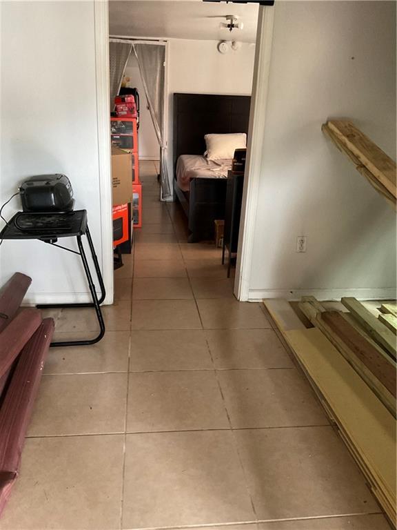 2909 1st St, New Orleans, LA 70113 - hall featuring light tile patterned floors