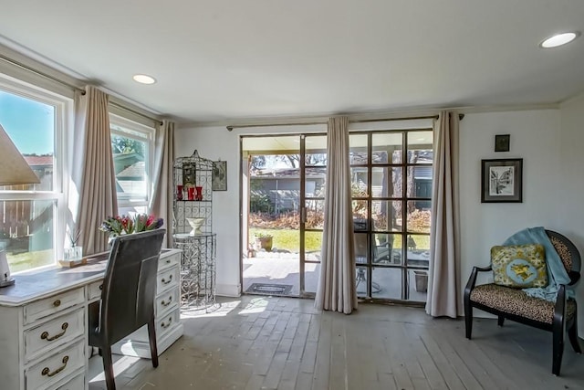 home office with light wood-style floors and recessed lighting