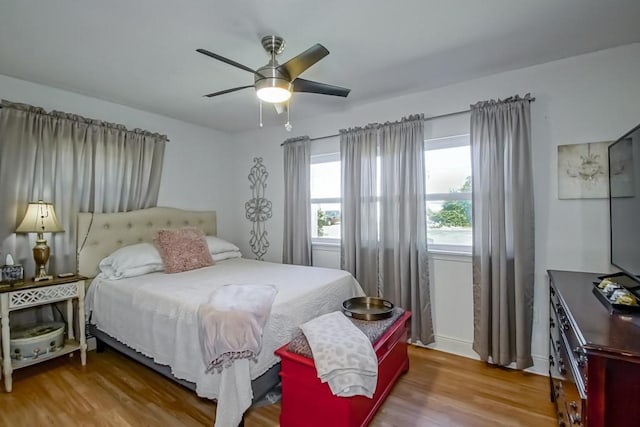 bedroom featuring ceiling fan and wood finished floors