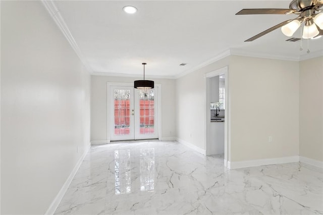 spare room featuring crown molding, marble finish floor, french doors, and baseboards