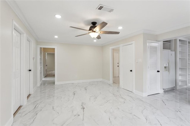 unfurnished bedroom with white refrigerator with ice dispenser, visible vents, crown molding, and baseboards