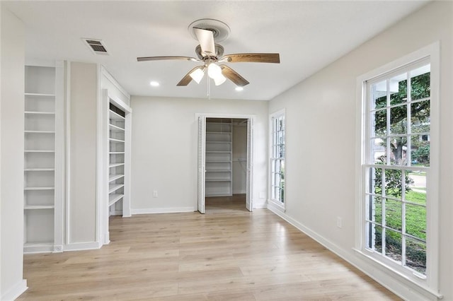 unfurnished bedroom featuring light wood-type flooring, baseboards, visible vents, and recessed lighting