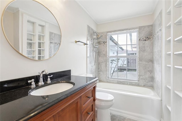 bathroom featuring toilet, vanity, and shower / bathing tub combination