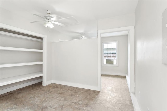 spacious closet with ceiling fan and cooling unit