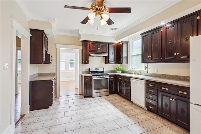 kitchen with white appliances, visible vents, light countertops, crown molding, and under cabinet range hood