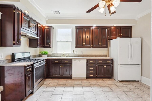 kitchen with crown molding, light countertops, white appliances, and under cabinet range hood