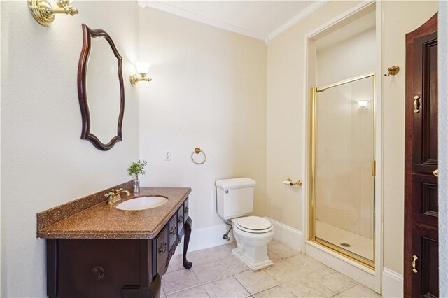 bathroom featuring toilet, ornamental molding, a shower stall, vanity, and baseboards